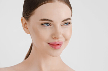 Obraz na płótnie Canvas Beautiful woman face healthy skin natural make up lips close up blue eyes