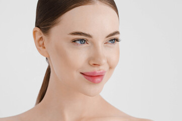 Obraz na płótnie Canvas Beautiful woman face healthy skin natural make up lips close up blue eyes