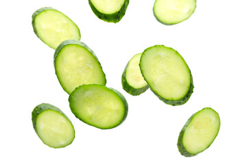 Flying cut cucumbers on white background