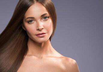 Beautiful woman with long beautiful smooth hair natural make up healthy skin