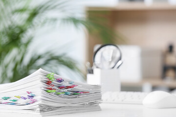 Stack of documents on table in office