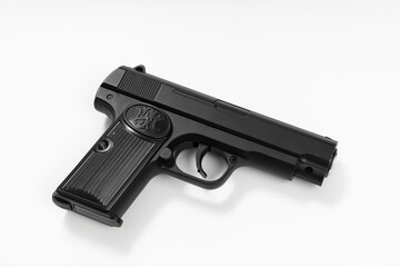 toy black gun on a white background. dangerous toys.