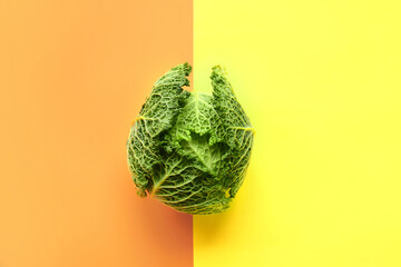 Fresh savoy cabbage on color background