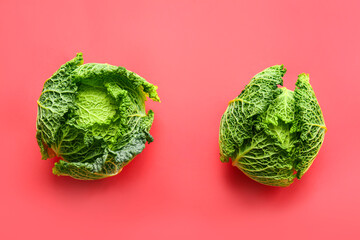 Fresh savoy cabbage on color background