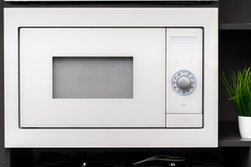 Obraz premium New modern microwave oven in a shop, close up