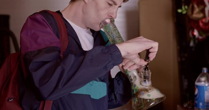 guy smoking a bong