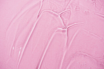 Close up macro Aloe vera gel cosmetic texture pink background with bubbles.