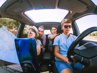 Naklejka premium group of friends in car