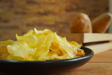 Potato crisps served in a bowl.