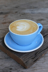 latte art on wooden floor