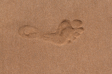 Close up footprints on tropical sand beach.