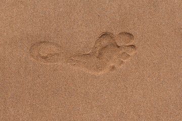 Fototapeta na wymiar Close up footprints on tropical sand beach.