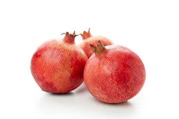 Ripe pomegranate fruits isolated on white background