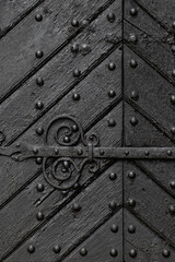 Black Wood Door with Forged Metal Details. Black Entrance