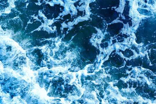 Deep blue and rough sea with lot of sea spray.Blue background.Soft focus,blurred image. © ARVD73