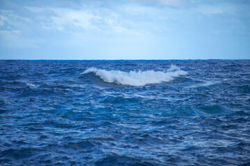 Naklejka na ściany i meble Summer sea background. Texture of water surface. Shining blue water ripple pattern.