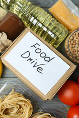 Concept of food drive with meal on wooden table
