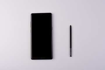 smartphone with stylus isolated on white background.