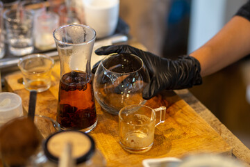 selective focus glass jar in brown tea Tea with coffee beans, fragrant, refreshing in a coffee shop