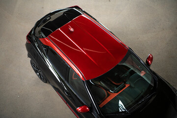 Top view of a modern red SUV car. Details of a car rooftop.