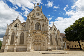 Fototapeta na wymiar BOURG-EN-BRESSE, FRANCE, June 29, 2021 : Outdoor view of main facade of the church of Brou Royal Monastery