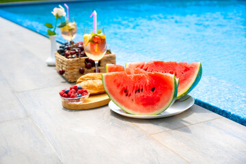 Breakfast by the pool. Watermelon, berries, croissants, non-alcoholic cocktails by the pool.