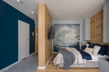 Stylish bedroom with wooden walls and decorative wall mural