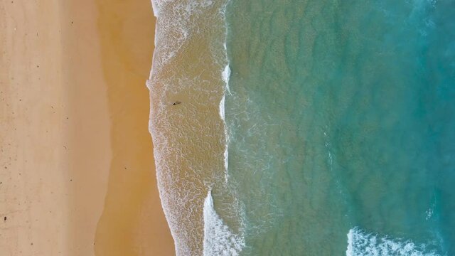 Beach sea in summer sun Aerial view Top-down shot. Phuket, Thailand 4K Nature and travel concept. Shot on drone high quality camera.