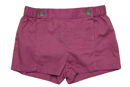 Summer shorts isolated. Close-up of stylish fashionable violet short shorts for the little girl with two buttoms isolated on a white background. Sexy childrens fashion. Front view.