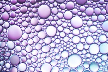 Colorful artistic of oil drop floating on the water. Abstract bubble background.