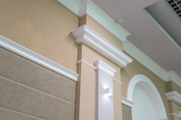 Detail of corner ceiling with intricate crown molding on column