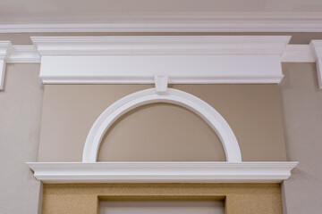 Detail of corner ceiling with intricate crown molding on column