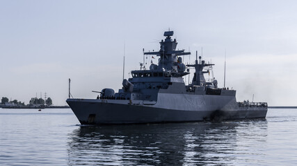 WARSHIP - A German Navy corvette is maneuvering in a port 
