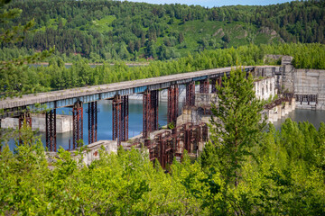 View of abandoned hydroelectric power plant on the Taidon River in Siberia, Russia