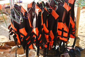 life jacket in orange color important for life security in the water or the sea and The ocean for...
