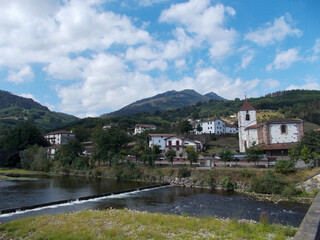 Fototapeta na wymiar Municipality of Elizondo, in the Baztán valley with the Bidasoa river and the water dam, in Navarra, Spain. Europe. Horizontal photography.