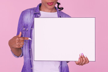 Close up of a blank board being held by a smiling woman