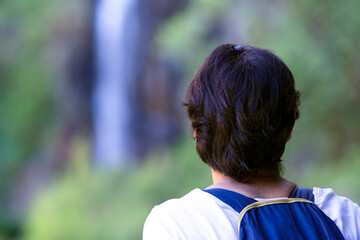 brave woman free in trekking hiking , Madeira island , 25 fontes and Risco routs , focus in foreground