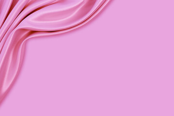 Beautiful elegant wavy pink satin silk luxury cloth fabric texture with monochrome background design. Copy space