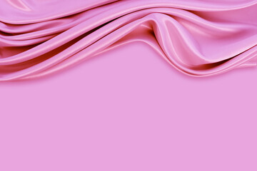 Beautiful elegant wavy pink satin silk luxury cloth fabric texture with monochrome background design. Copy space