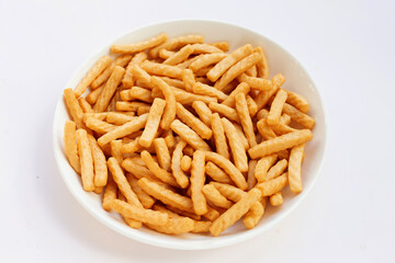 Prawn cracker sticks on white background. Shrimp crisp rice snack