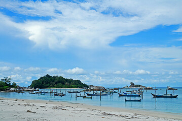 Fishing boats and view over coastal village at Belitung island,Indonesia