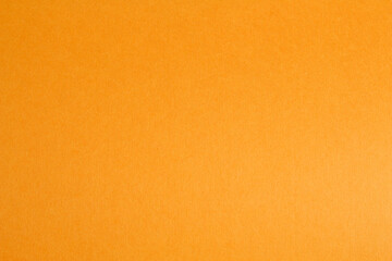 Empty copy space from orange colored sheet paper background