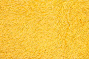 Abstract soft yellow fur carpet texture background