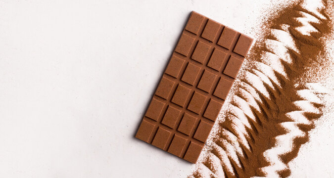 Milk Vegan Chocolate On A White Background. Copy Space. View From Above