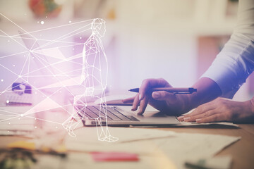 Double exposure of woman hands typing on computer and creative drawing. Start up concept.