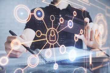 Double exposure of man hands holding a credit card and social network theme drawing. Digital finance and E-commerce concept.