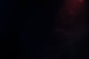 Blue and pink steam on a black background.