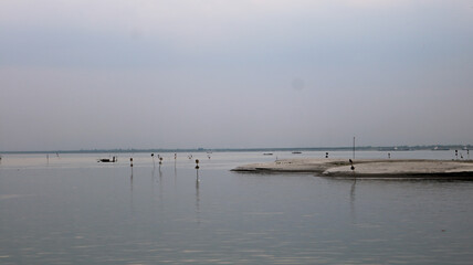 Beautiful evening view on the river bank. The sun's shadow on the river water has made a great impact afterward.