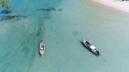 Top view or aerial view of Beautiful crystal clear water and white beach with long tail boats in summer of tropical island named Koh Lipe in Satun,Southern Thailand.